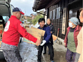 AAR Ohara (left) delivers relief supplies