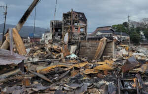 The smell of burnt-out buildings still lingers