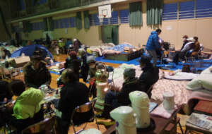 Survivors huddled in a shelter in Suzu city