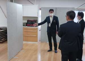 Mr. Kitani is giving visitors a tour