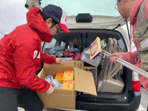 AAR team loading relief supplies into vehicle