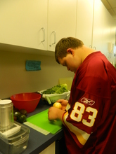Student peeling an onion.