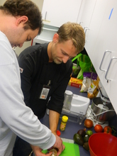 Student measuring spices for the recipe.