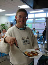 Michael makes pizza bagels in a cooking class.