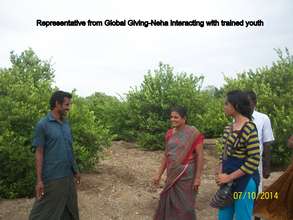 Global Giving Rep interacting with trained Youth