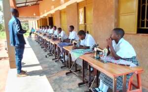 Students are sitting on their sewing machines