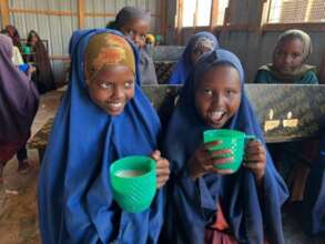 learners enjoying nutrious porriage  in school