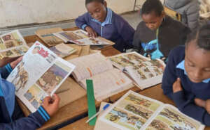 Children reading the Wild Dog comic