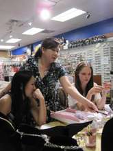 Lisa, Jenny, and Coco working on the designs.
