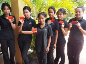 Our artisans proudly holding their new debit cards