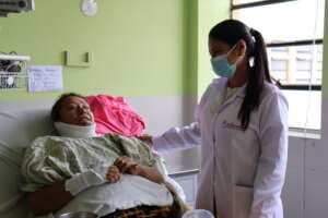 Aniquem professional supporting a patient