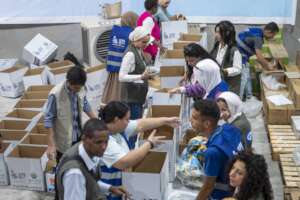 Packing food parcels for Gaza | Plan International