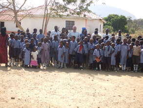 Michael Bell with Children and Staff of GCS