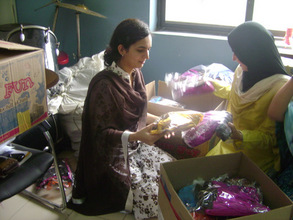 Volunteers packing the gift boxes