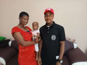Our Project Leader with Mercy and her child