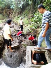 Operator Boy installs the newly repaired pump