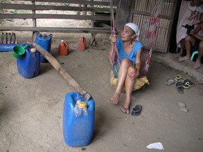 Nanay resting after fetching water from the spring