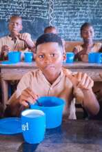 Schoolkids enjoying canteen food
