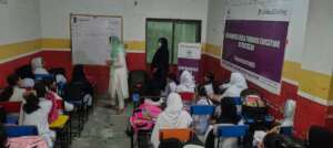 Facilitator is engaging girls in discussion