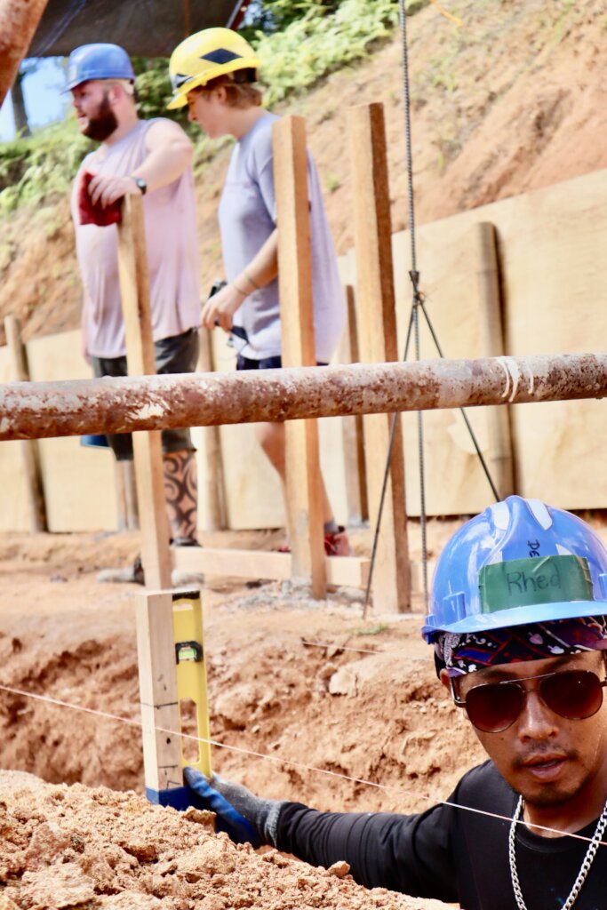 A local Filipino worker preparing the foundation!