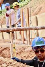 A local Filipino worker preparing the foundation!