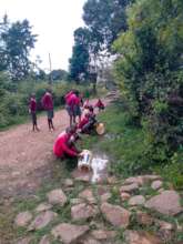 Kamorir pupils collects dirty water on streets