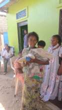 A woman carrying her afetr receiging also this