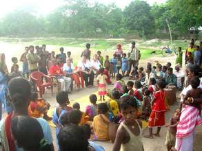Tribal villagers are meeting with GROW Team Member