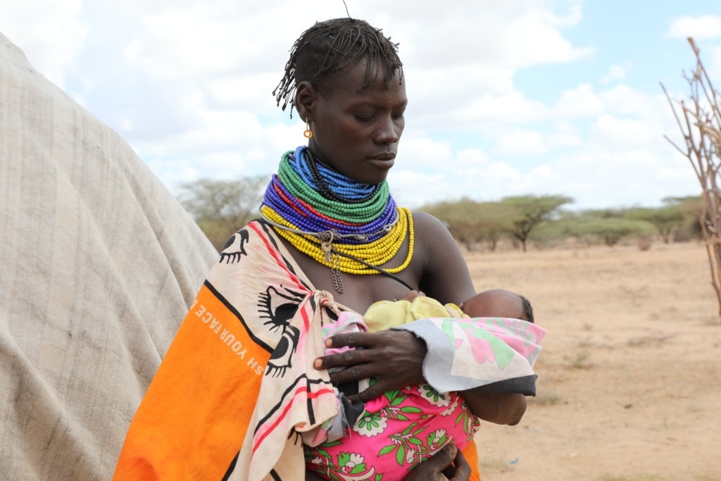 Asekon*, 33, holding her 2-month-old Akiru*