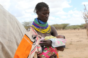 Asekon*, 33, holding her 2-month-old Akiru*