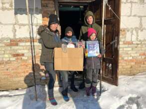 Ukrainian family having received books & supplies