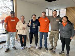 Volunteers from Home Depot install new flooring