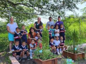 Students and parents at the school garden