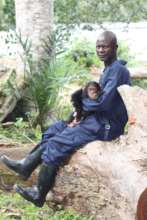Female chimpanzee with caretaker, Mokonzi