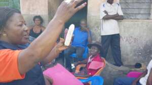Demosntrating how to use a Condom to IDPs