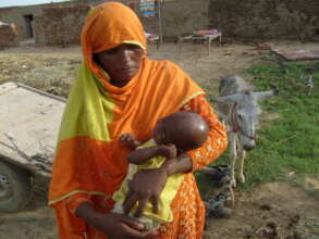 A Brick Kiln worker Women with her new born baby