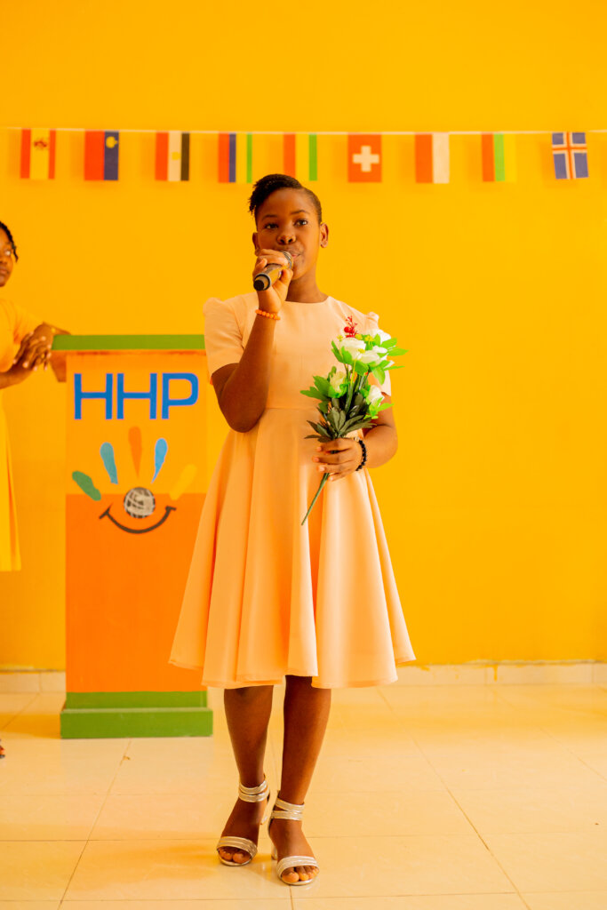 HHE podium with young girl speaking into microphon