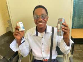 Teenage boy receives new glasses and medication