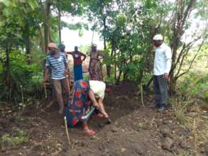 Digging a small hole in the ground to start