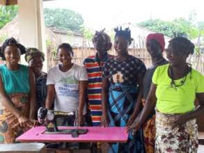 Excited ISL Women with one of the Sewing Machine