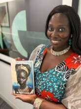 Dr. Adamawith a Copy of Her Book, Crown of Victory