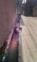 Water pipe passing through open drains