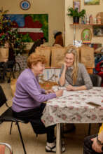 Dava partiku director talks with a client