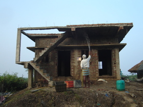 Partly completed House and watering is being done