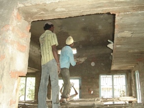 Masonry work is being done inside the house