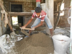 Cement concrete is being mixed for Masonry work