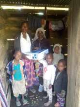 The family with the solarkit box.
