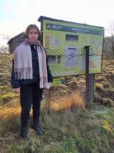 PhD Student Katerna with a Geoinformation Sign