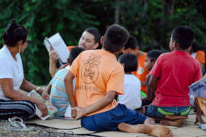 Volunteers  reading to Amazon Children