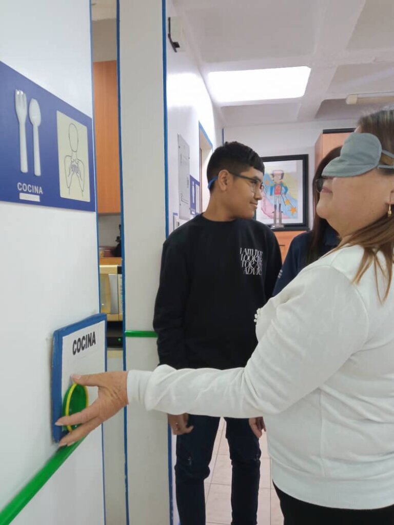 Simulation of a deafblind person taking a tour in